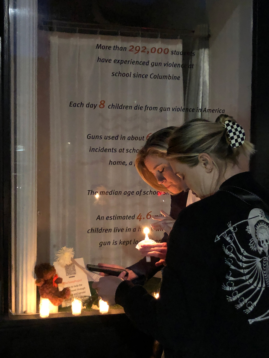 2 neighbors during the vigil for the victims of the Uvalde, TX massacre on May 25, 2022. The vigil was held outside of Windows on Franklin were ATB was exhibited.